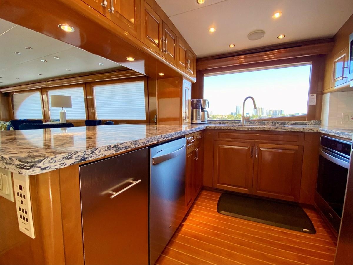 a kitchen with a large island aboard DREAM ON Yacht for Sale