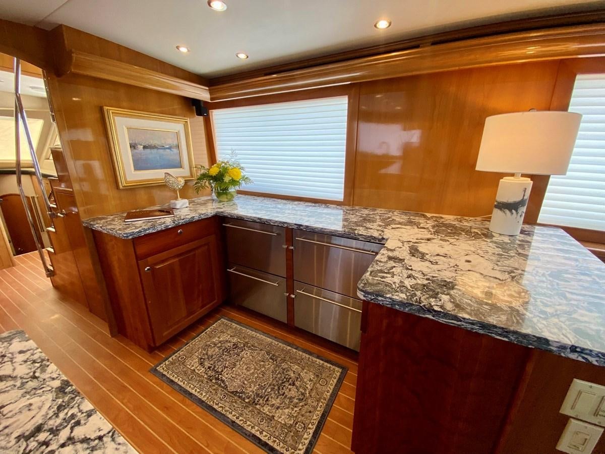 a kitchen with marble counter tops aboard DREAM ON Yacht for Sale