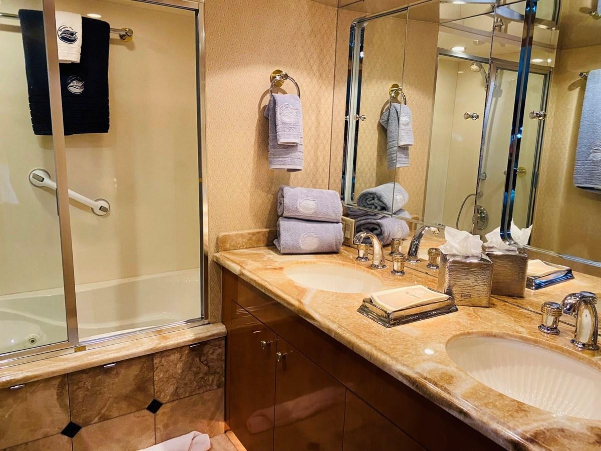 a bathroom with a large mirror aboard DREAM ON Yacht for Sale