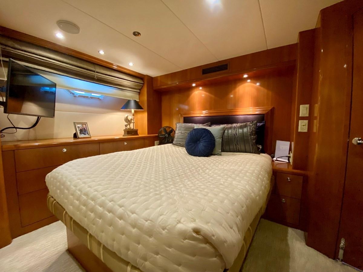 a couple of people sit on a bed aboard DREAM ON Yacht for Sale