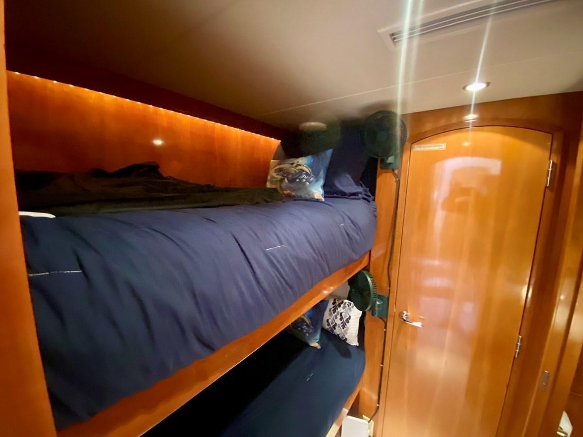 a person lying on a bed aboard DREAM ON Yacht for Sale