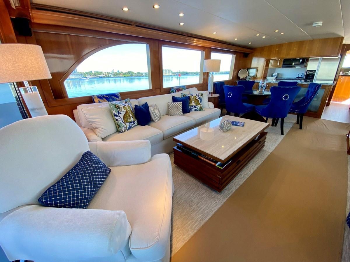 a living room with a large window aboard DREAM ON Yacht for Sale