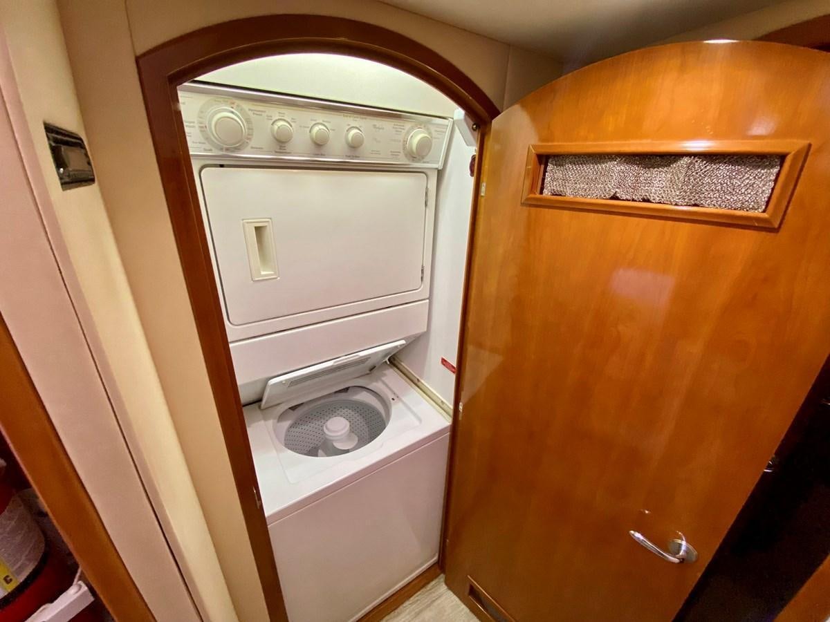 a washer and dryer in a room aboard DREAM ON Yacht for Sale