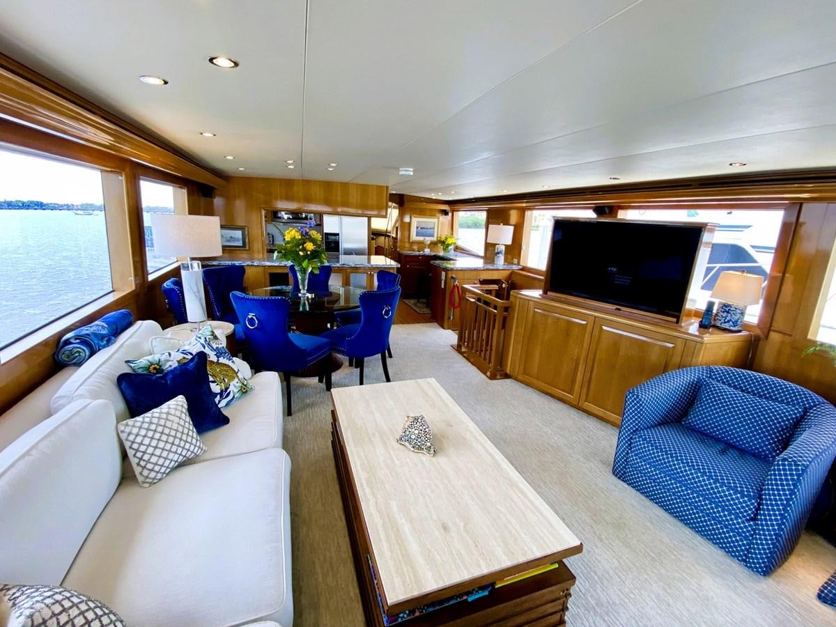 a living room with a couch and a television aboard DREAM ON Yacht for Sale