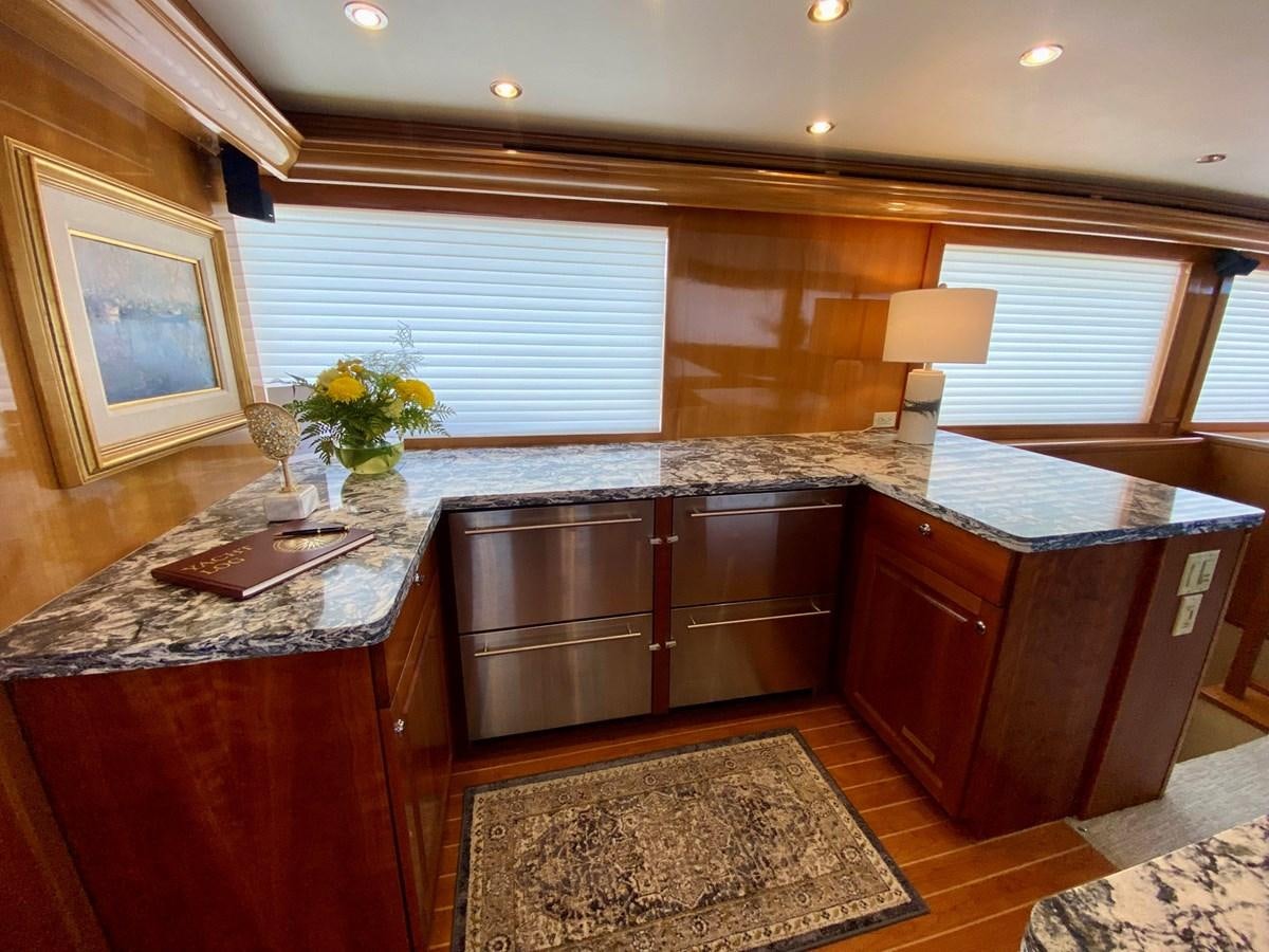 a kitchen with wooden cabinets aboard DREAM ON Yacht for Sale