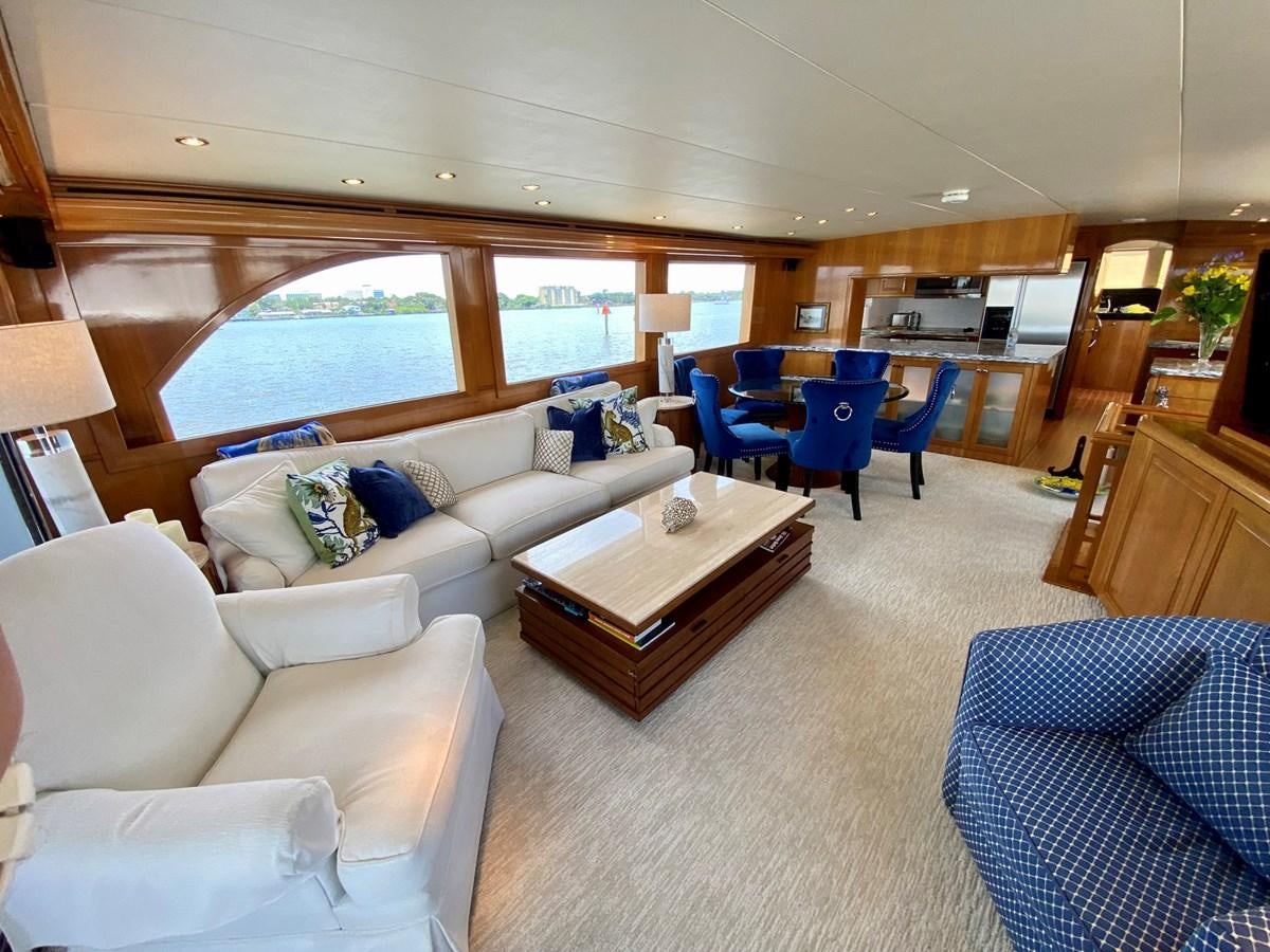 a living room with a couch and a table aboard DREAM ON Yacht for Sale