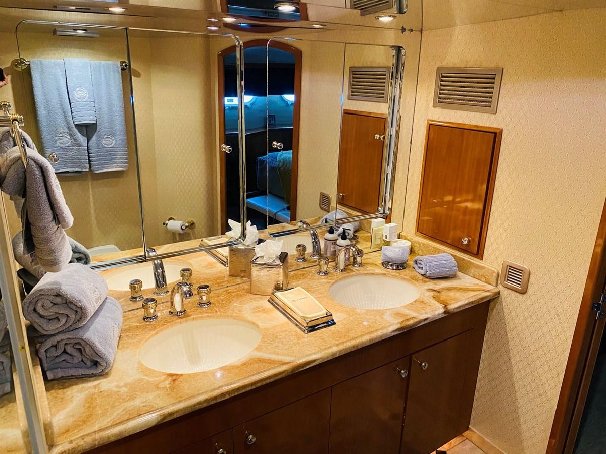 a bathroom with a large mirror aboard DREAM ON Yacht for Sale