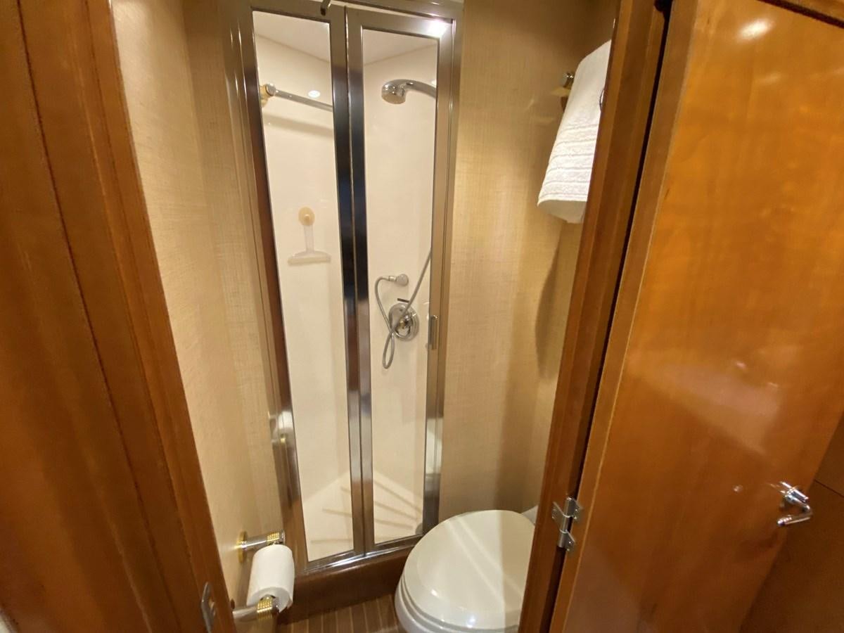 a bathroom with a glass shower aboard DREAM ON Yacht for Sale