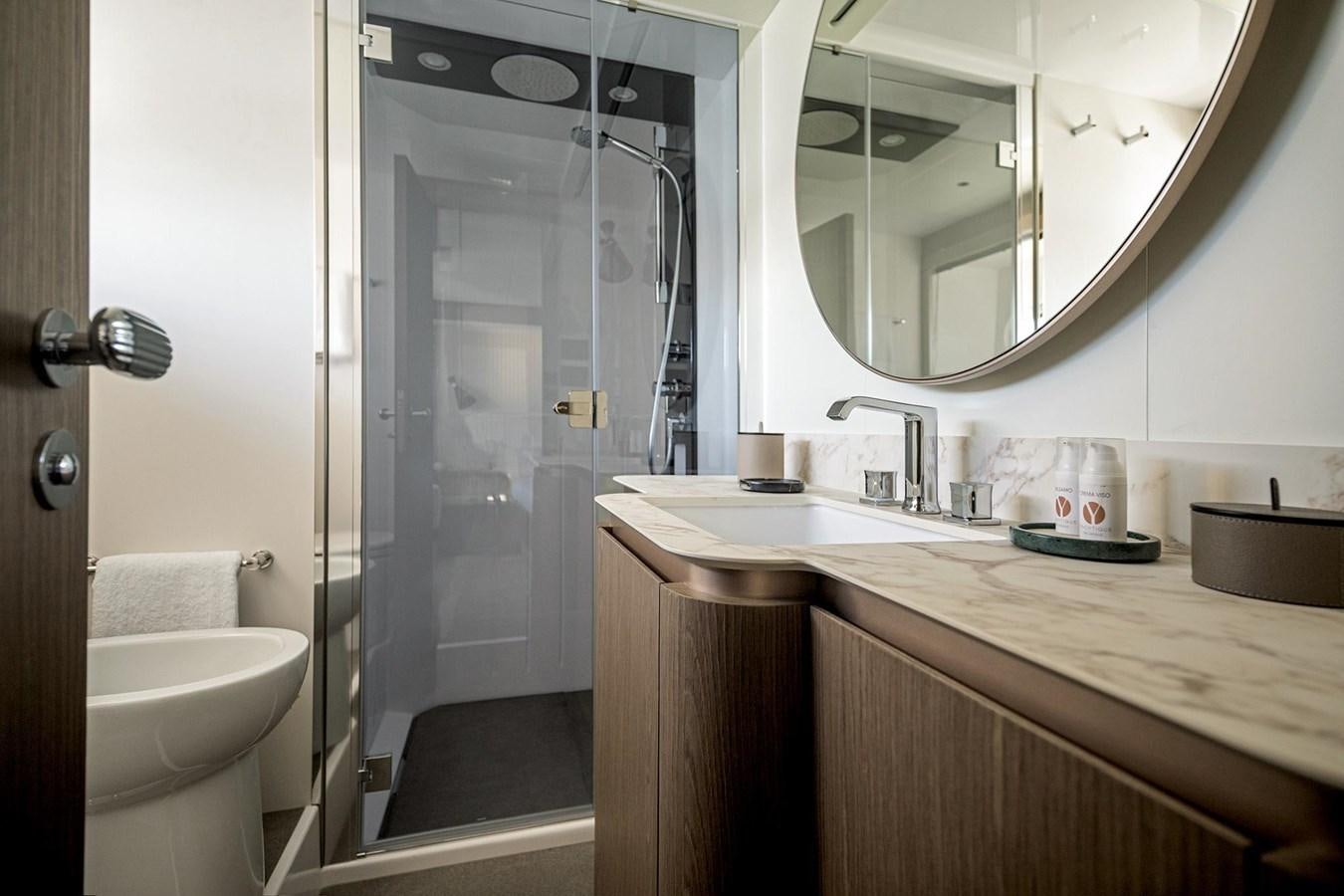a bathroom with a glass shower aboard AZIMUT MAGELLANO 66 Yacht for Sale