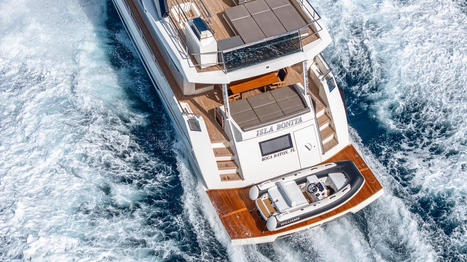 a small wooden boat on a snowy lake aboard ISLA BONITA Yacht for Sale