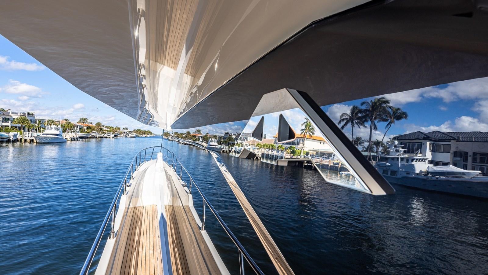a bridge over water with boats aboard ISLA BONITA Yacht for Sale