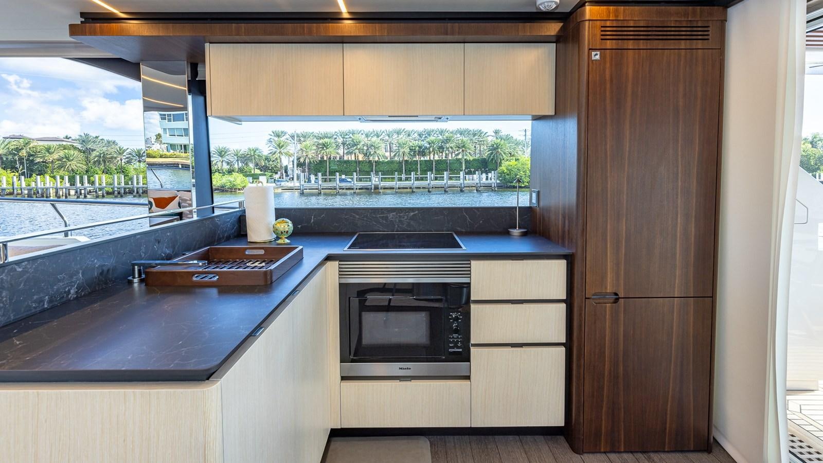 a kitchen with a microwave oven aboard ISLA BONITA Yacht for Sale