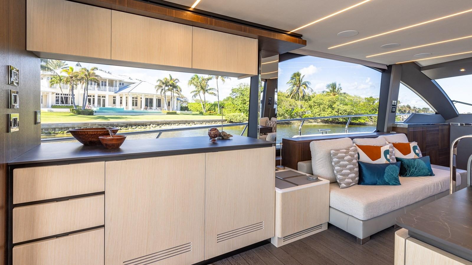 a living room with a large window aboard ISLA BONITA Yacht for Sale