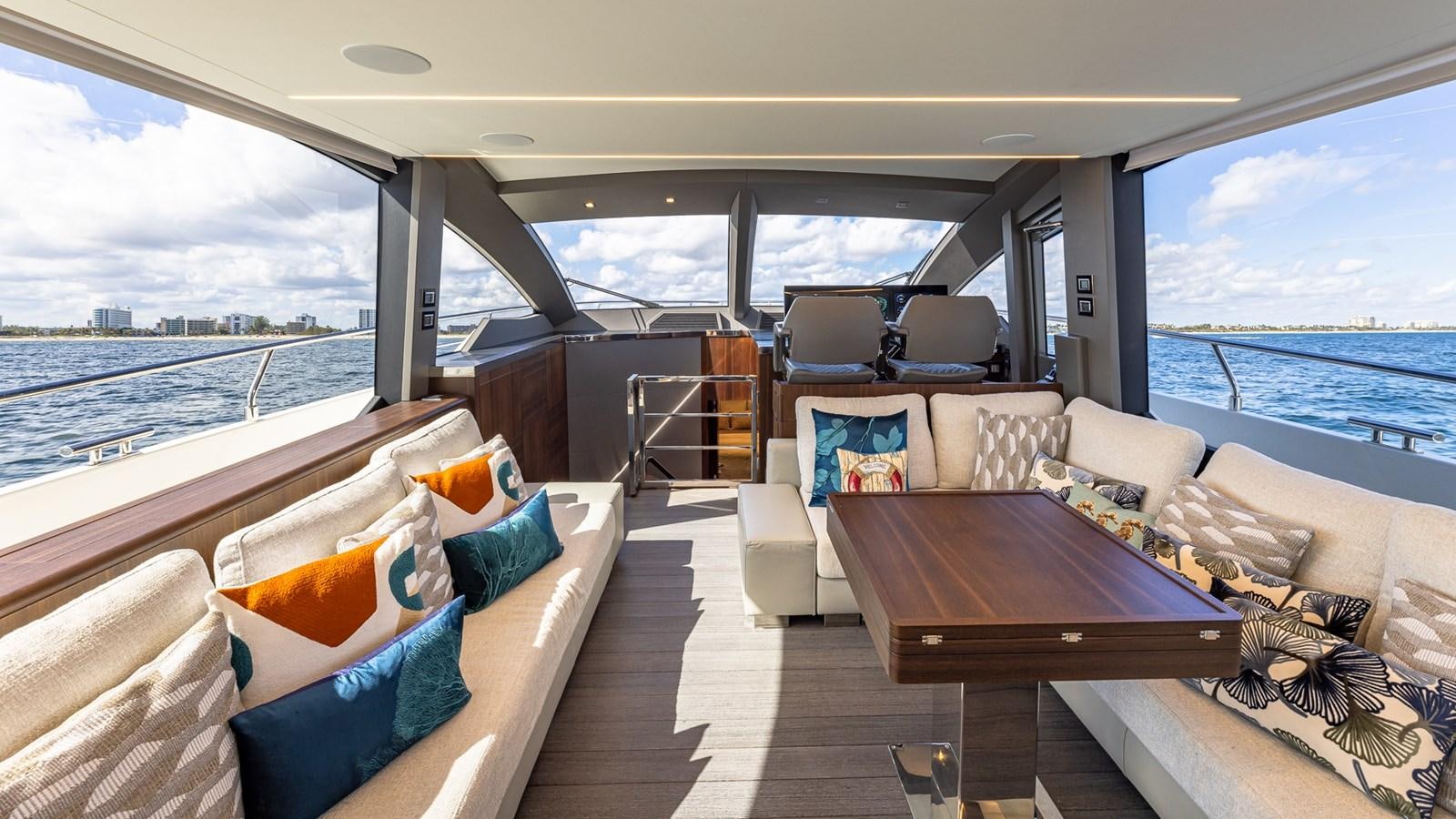 a boat with a table and chairs aboard ISLA BONITA Yacht for Sale