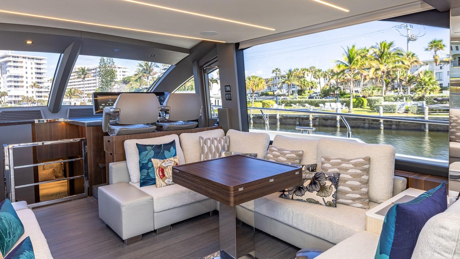 a living room with a couch and a table aboard ISLA BONITA Yacht for Sale