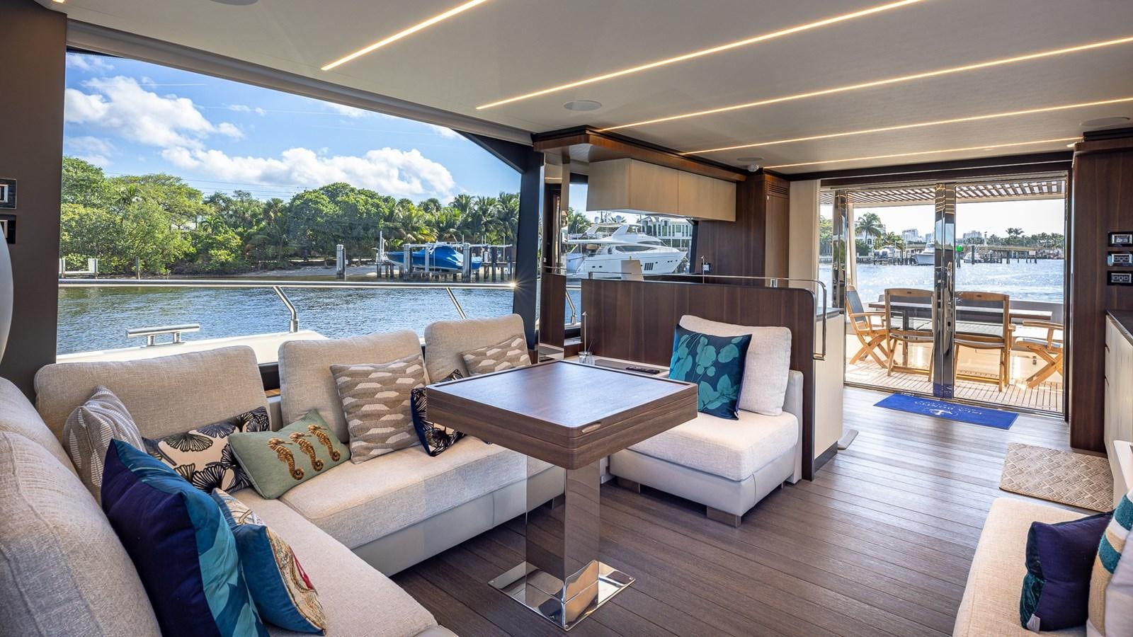 a living room with a large patio aboard ISLA BONITA Yacht for Sale