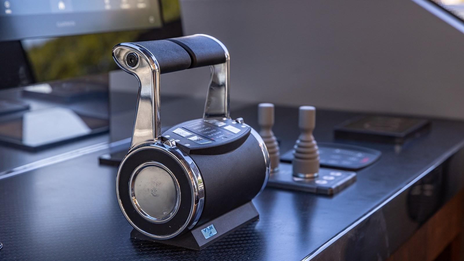 a camera on a table aboard ISLA BONITA Yacht for Sale