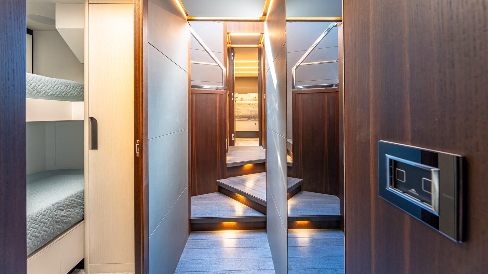 a room with a bed and a television aboard ISLA BONITA Yacht for Sale