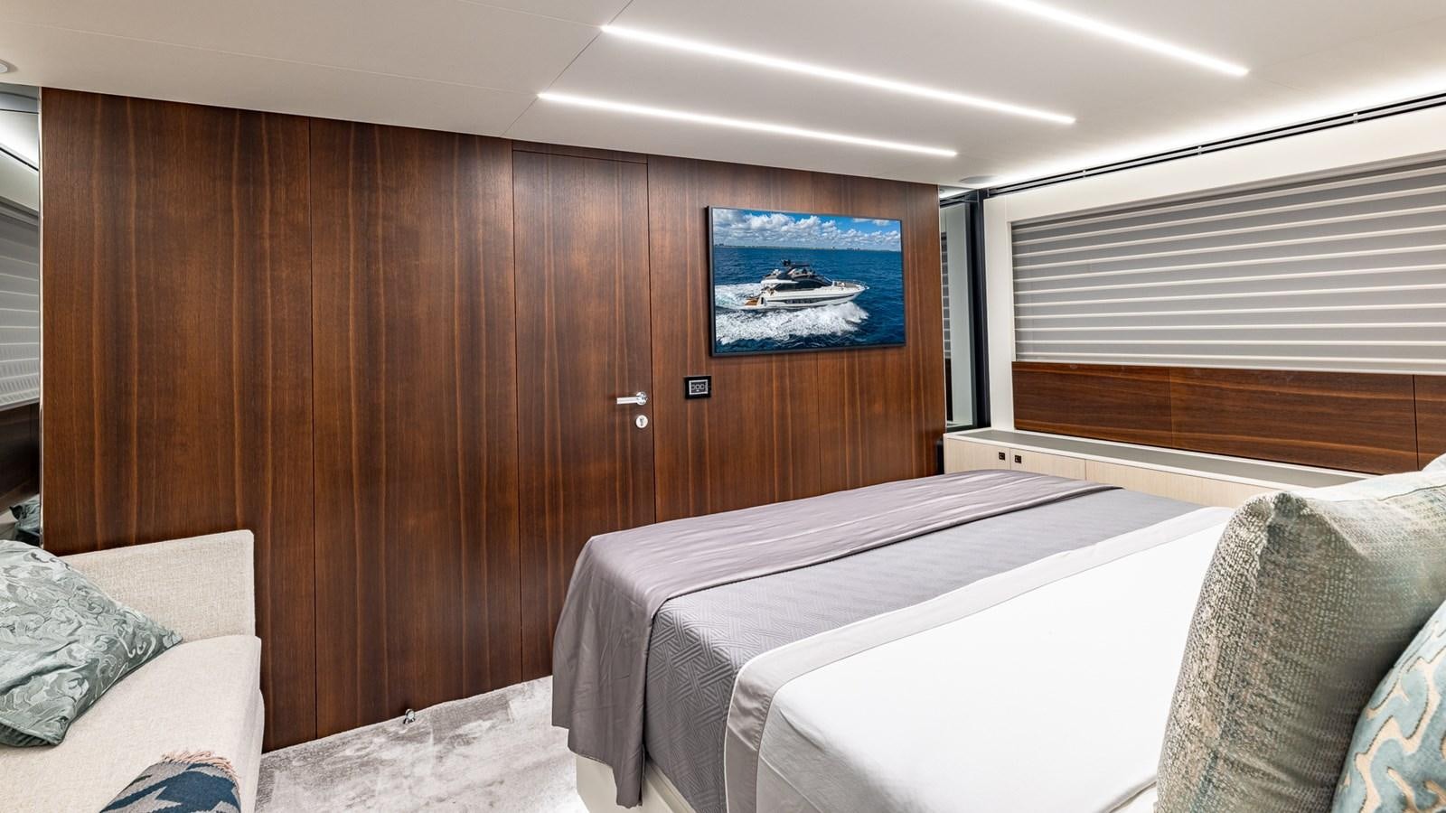 a room with a couple of beds aboard ISLA BONITA Yacht for Sale