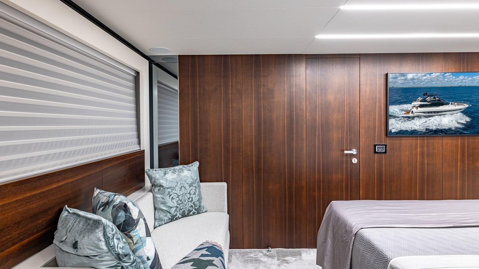 a room with a bed and a television aboard ISLA BONITA Yacht for Sale