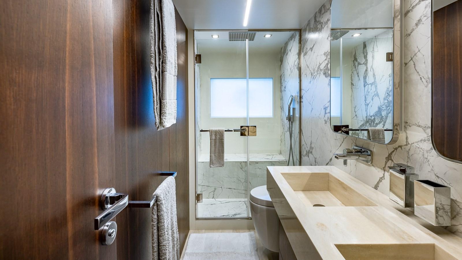 a bathroom with a bathtub and toilet aboard ISLA BONITA Yacht for Sale