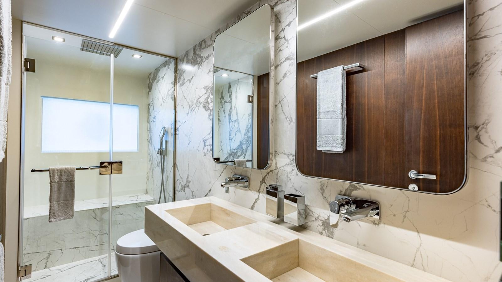 a bathroom with a large mirror aboard ISLA BONITA Yacht for Sale