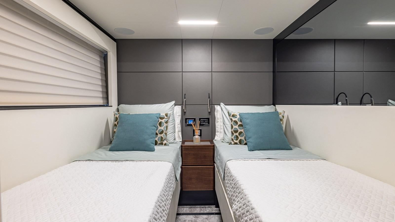 a room with two beds aboard ISLA BONITA Yacht for Sale
