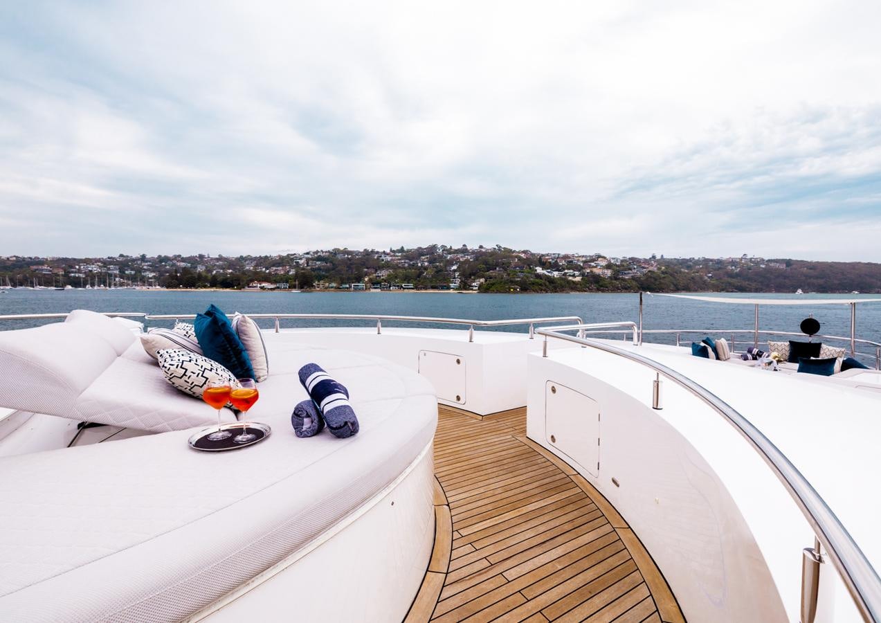 a deck with a view of a city and water aboard EVOLUTION 1 Yacht for Sale