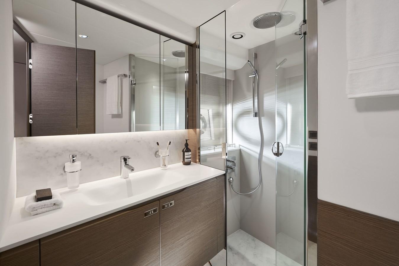 a bathroom with a glass shower aboard SPIRIT OF RIO Yacht for Sale