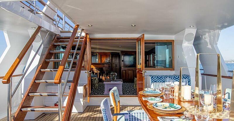 a wooden staircase in a house aboard SEA BREEZE III Yacht for Charter