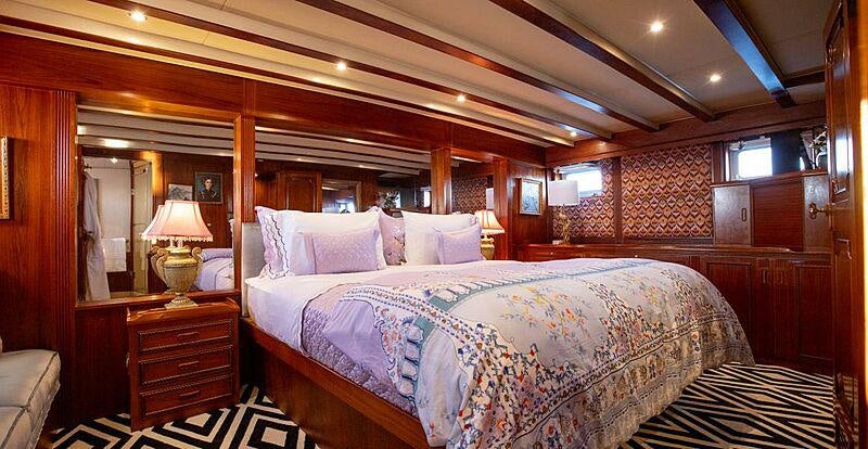 a large bed in a room aboard SEA BREEZE III Yacht for Charter