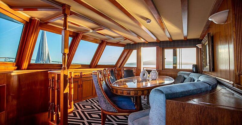 a room with a couch and a table aboard SEA BREEZE III Yacht for Charter