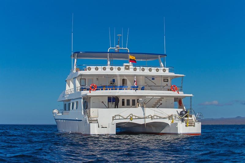 a large white boat in the water aboard TIP TOP II Yacht for Charter