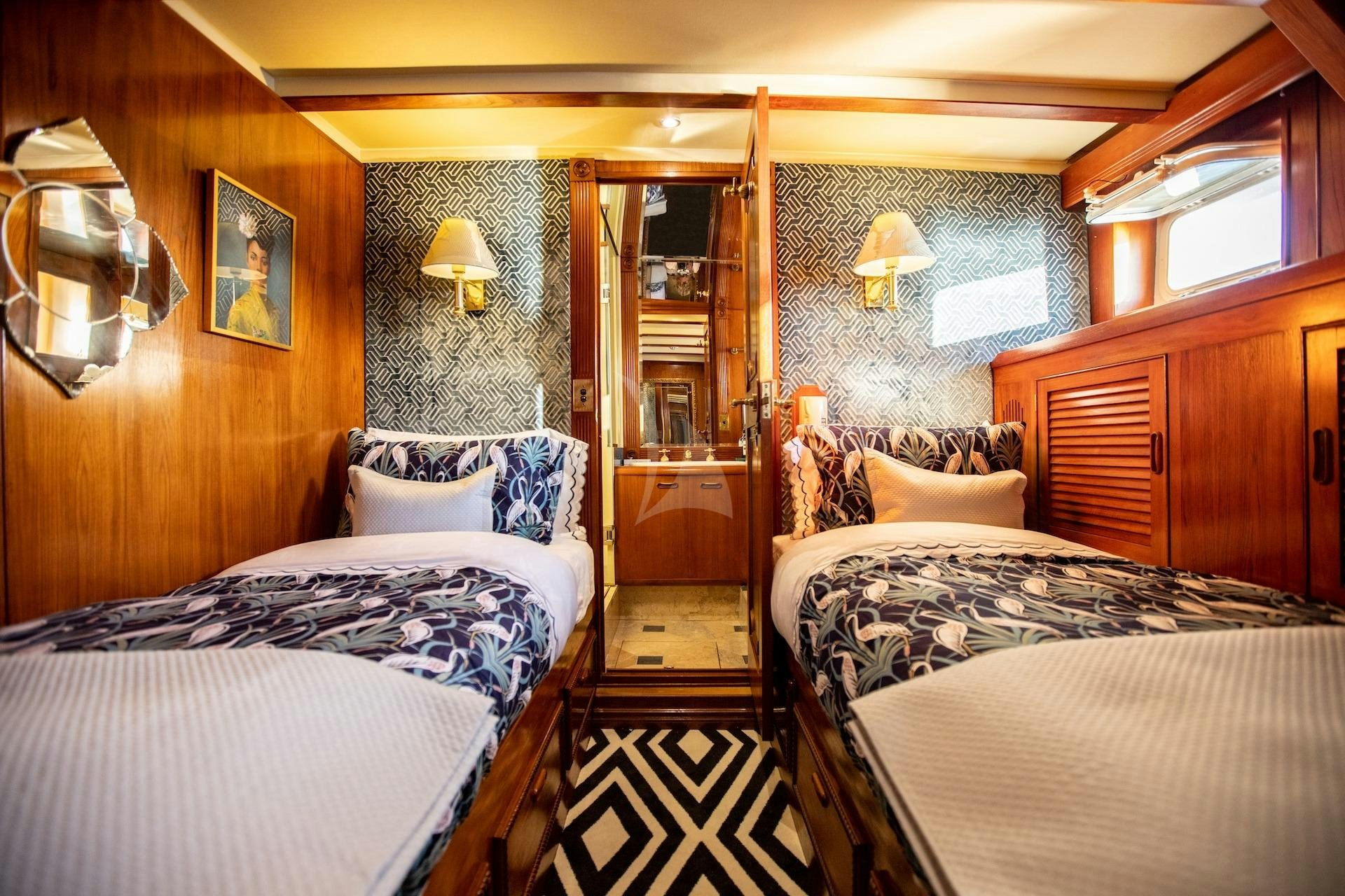 a couple of beds in a room aboard SEA BREEZE III Yacht for Charter