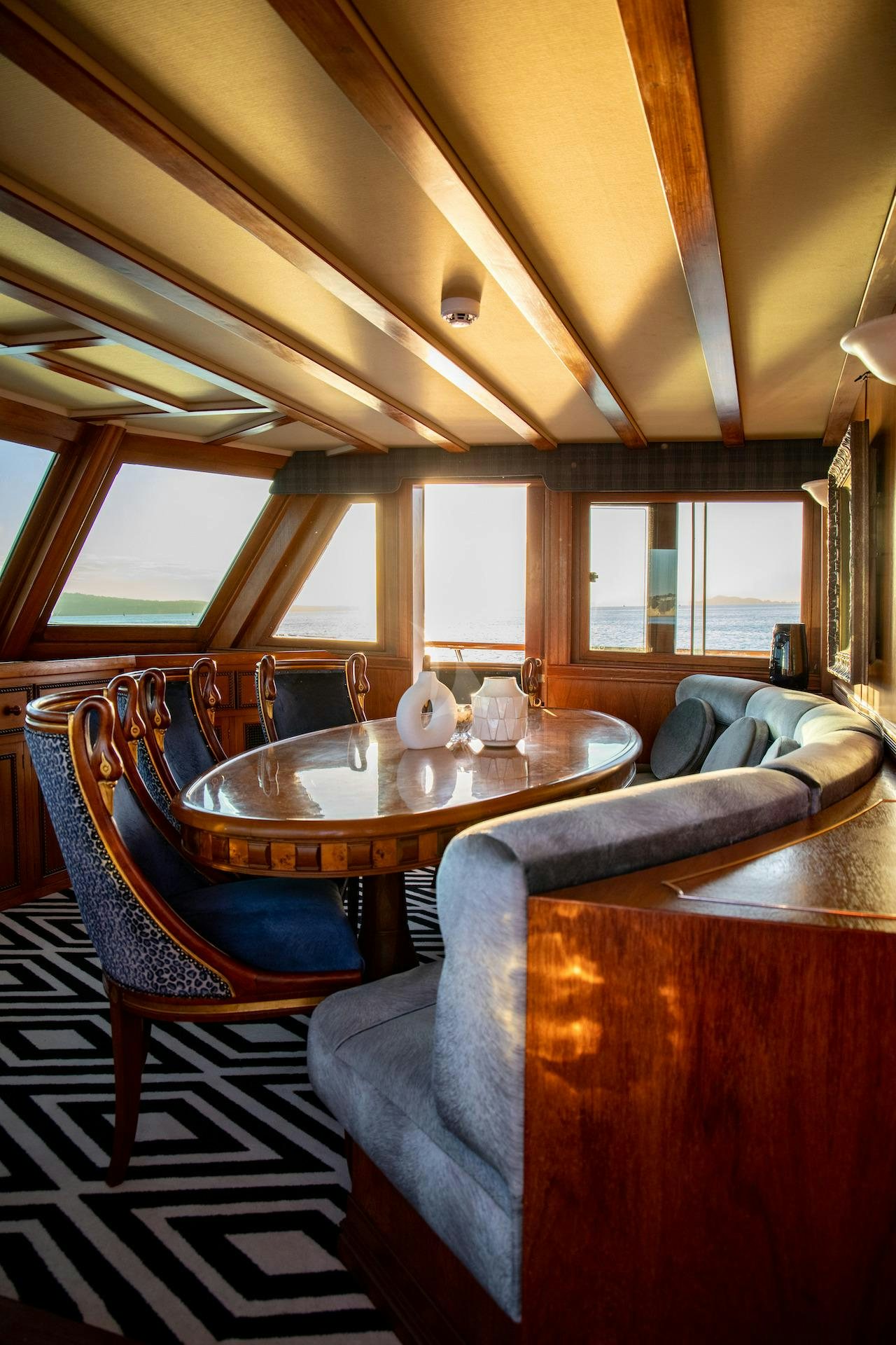 a dining table in a cabin aboard SEA BREEZE III Yacht for Charter
