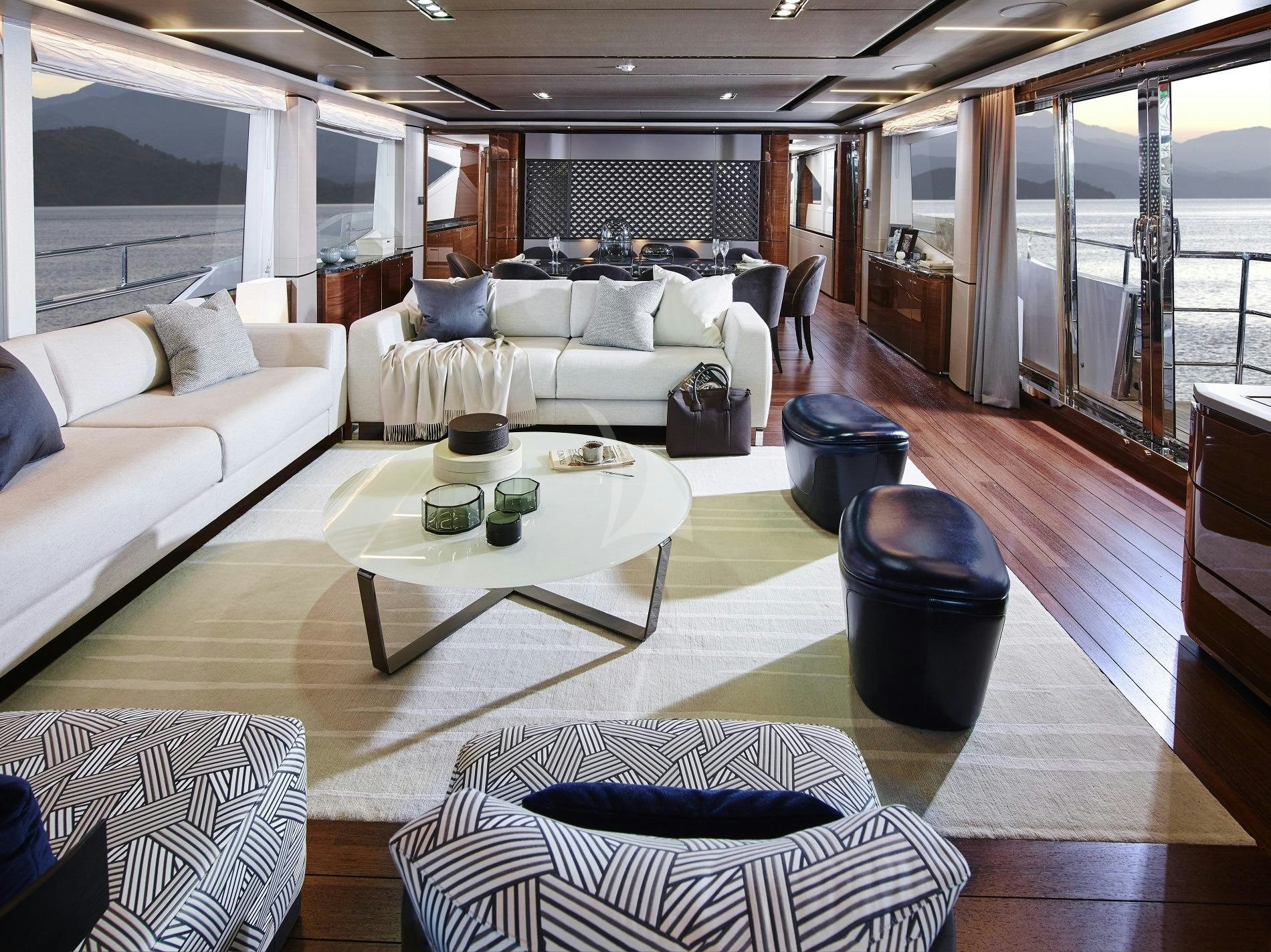 a living room with a large window aboard KOHUBA Yacht for Charter