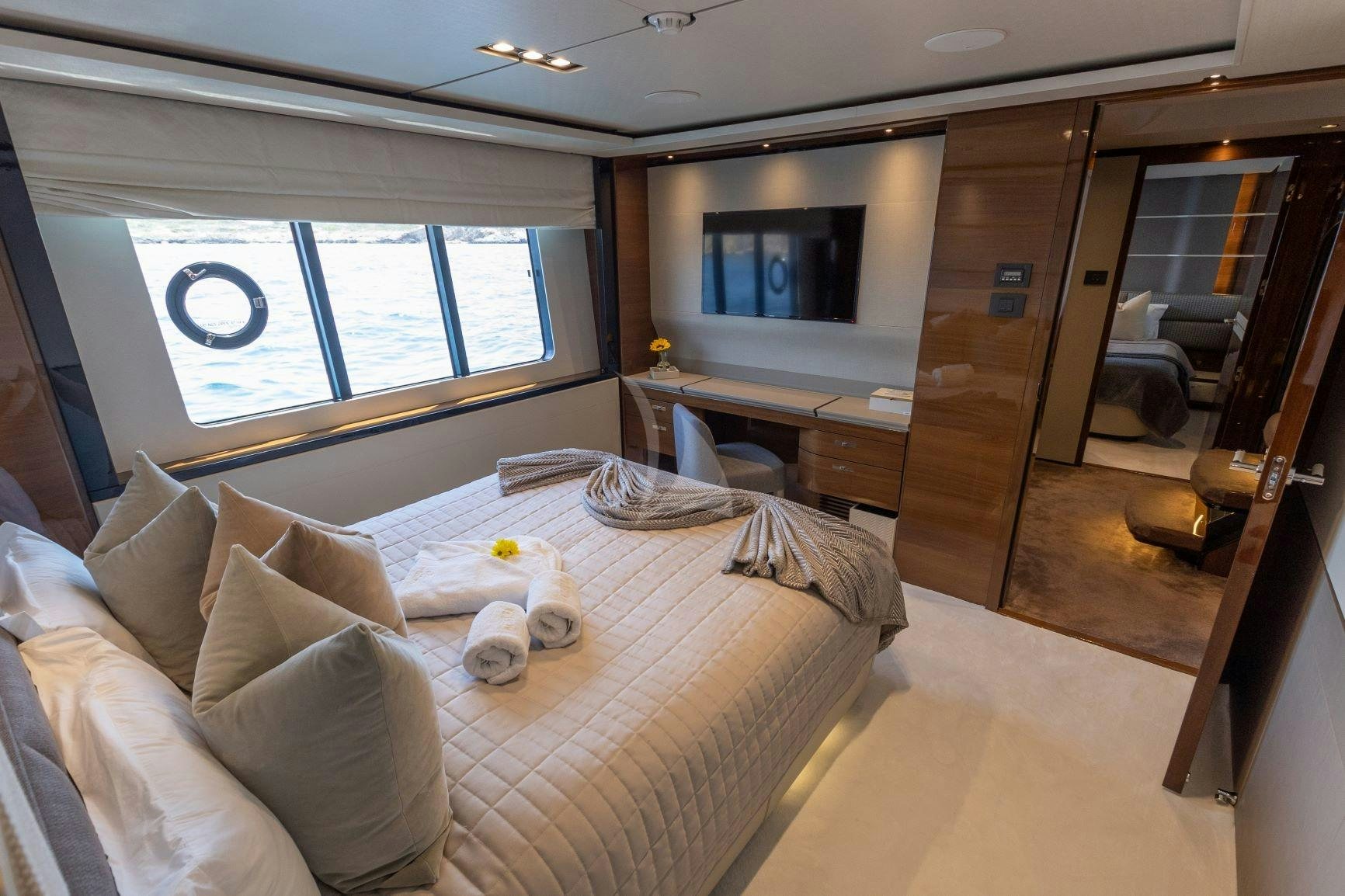 a large bedroom with a large bed aboard KOHUBA Yacht for Charter