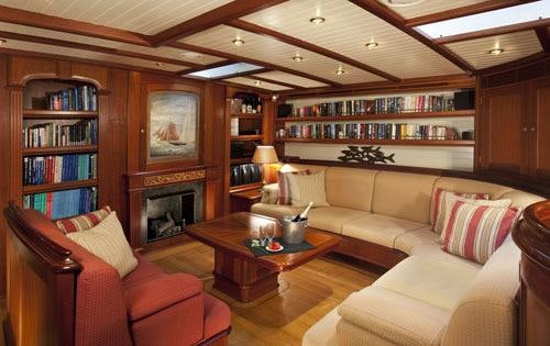 a living room with a fireplace aboard SHAMOUN Yacht for Charter