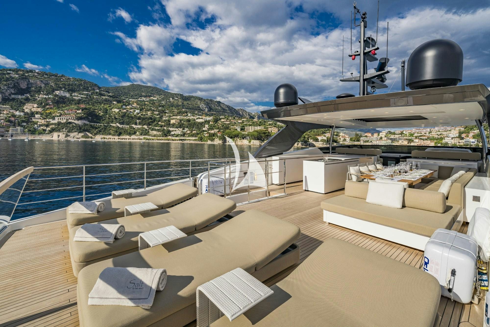 a deck with a deck and a large ship on it aboard SALT Yacht for Charter