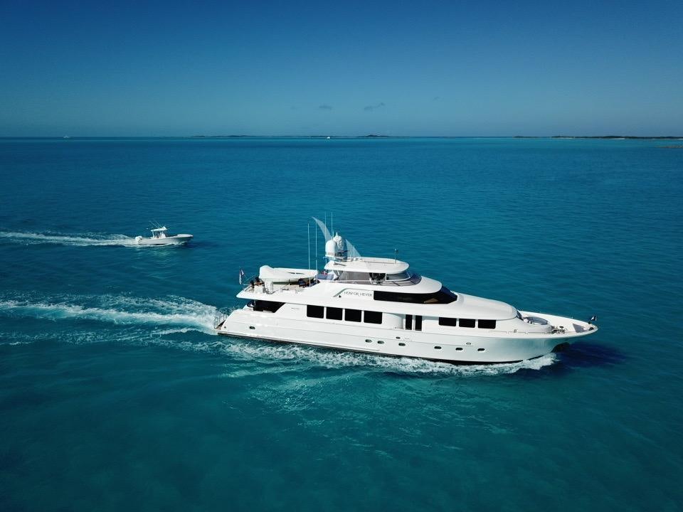 a white yacht in the ocean aboard NOW OR NEVER Yacht for Charter