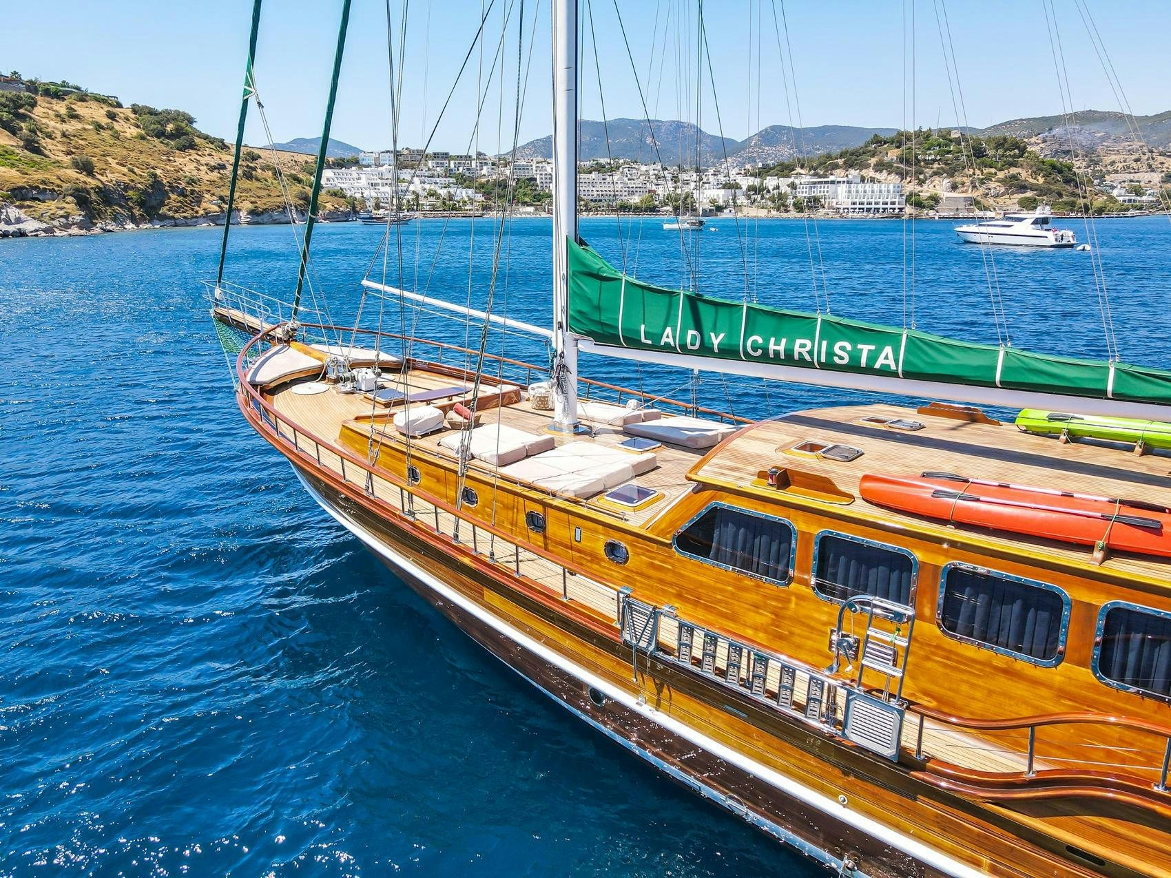 a yellow and red boat on water aboard LADY CHRISTA Yacht for Charter