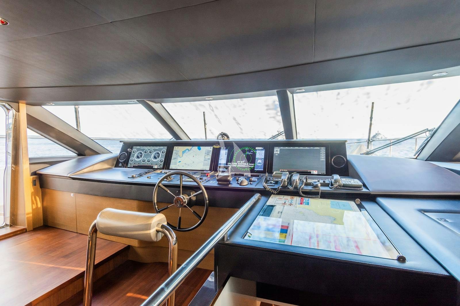a table with a computer on it aboard MINOR FAMILY AFFAIR Yacht for Charter