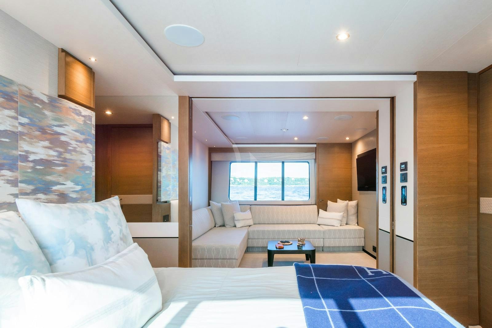 a room with a bed and a table aboard MINOR FAMILY AFFAIR Yacht for Charter