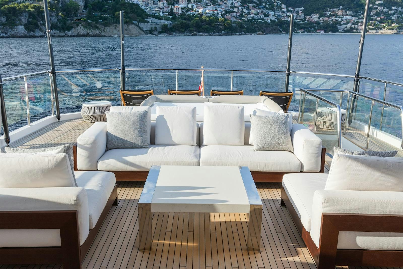 a deck with chairs and tables aboard MINOR FAMILY AFFAIR Yacht for Charter