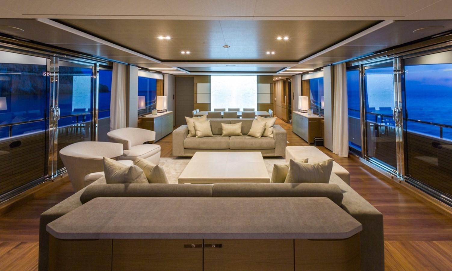 a living room with a large glass door aboard MINOR FAMILY AFFAIR Yacht for Charter