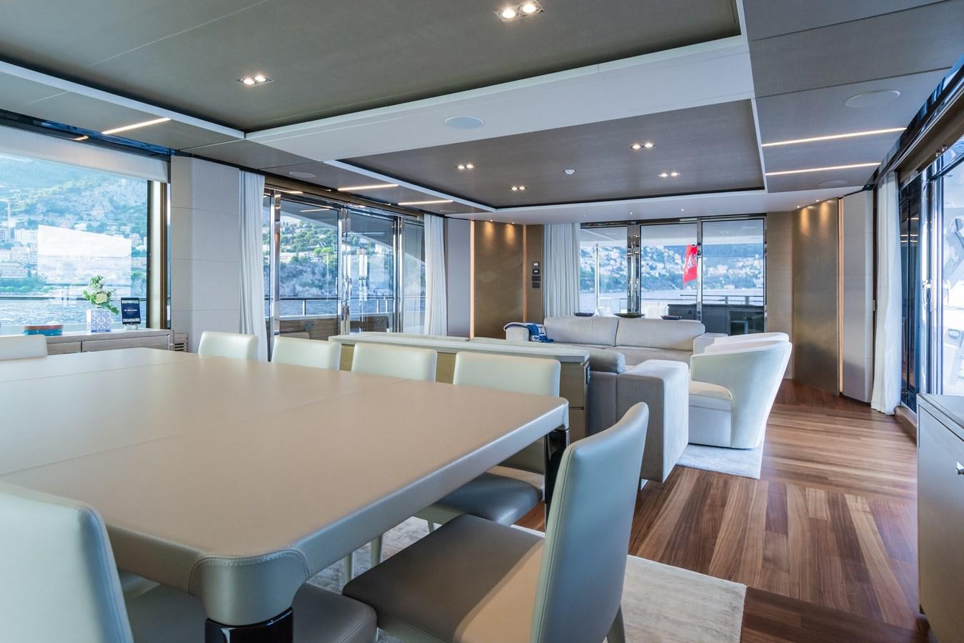a large room with a table and chairs aboard MINOR FAMILY AFFAIR Yacht for Charter