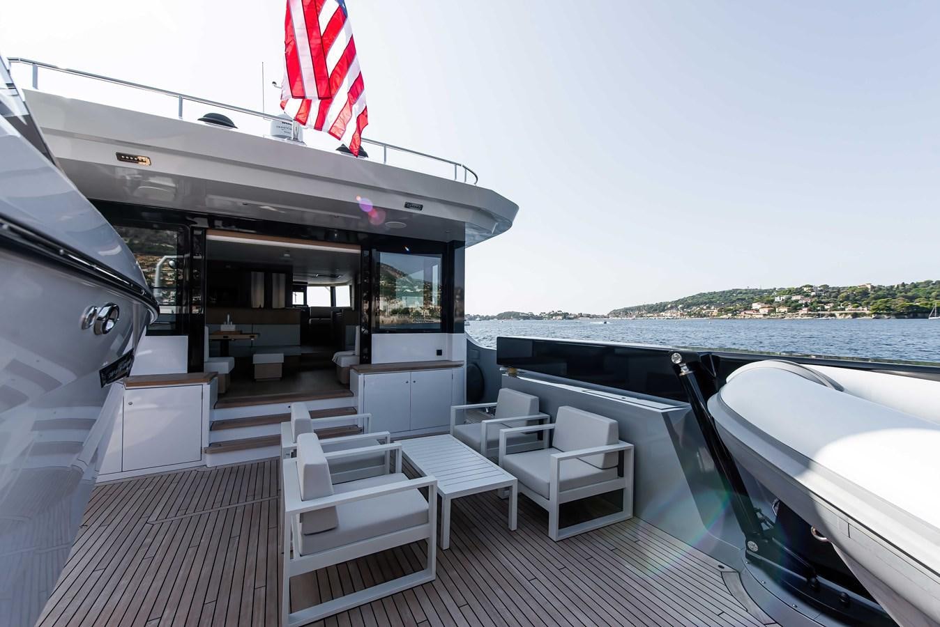 a boat on a deck aboard CROSSOVER 27M Yacht for Sale