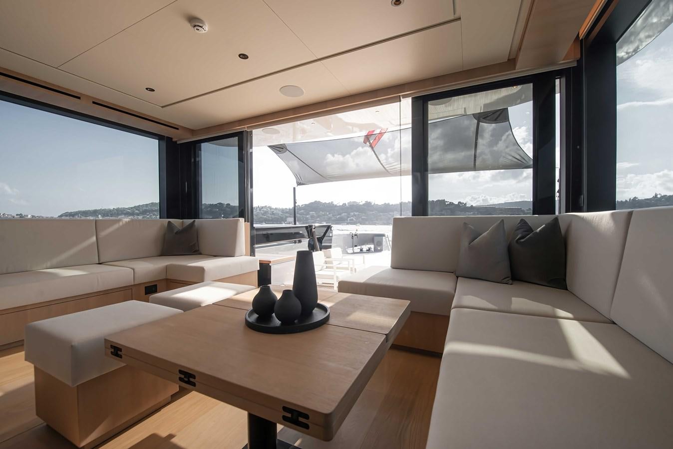 a living room with a large window aboard CROSSOVER 27M Yacht for Sale