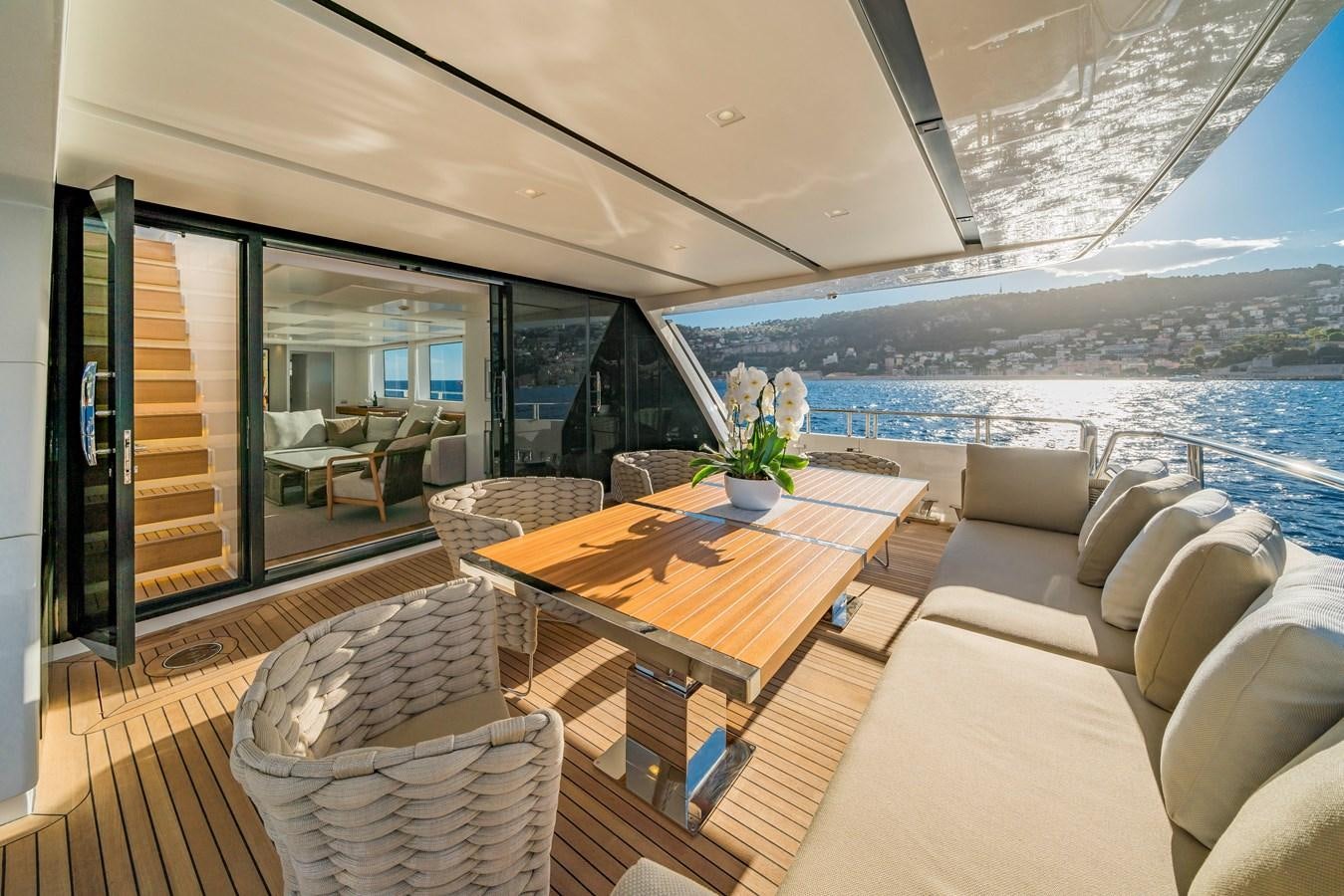 a living room with a large window aboard SALT Yacht for Charter