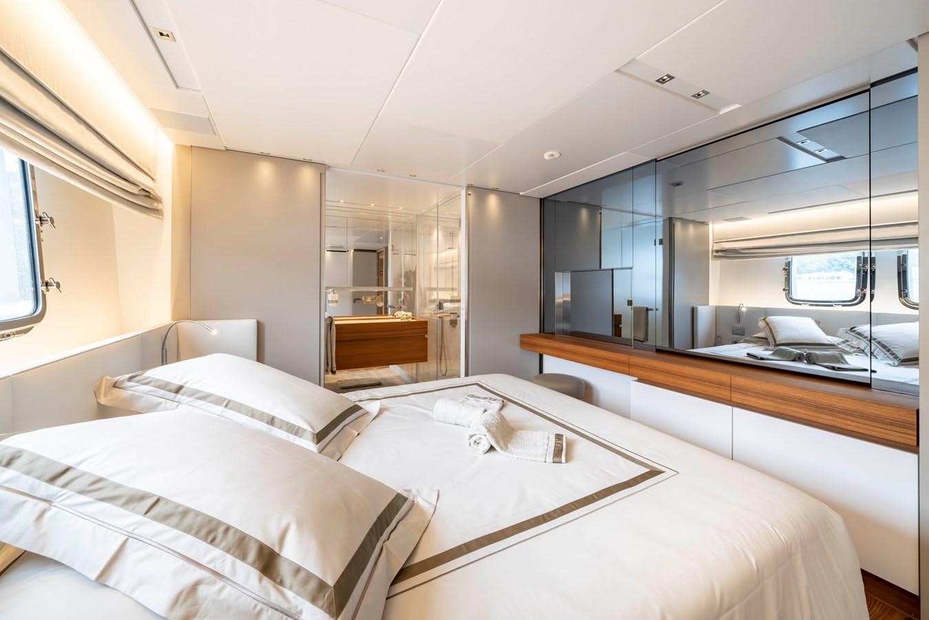 a room with a couple of beds aboard SALT Yacht for Charter